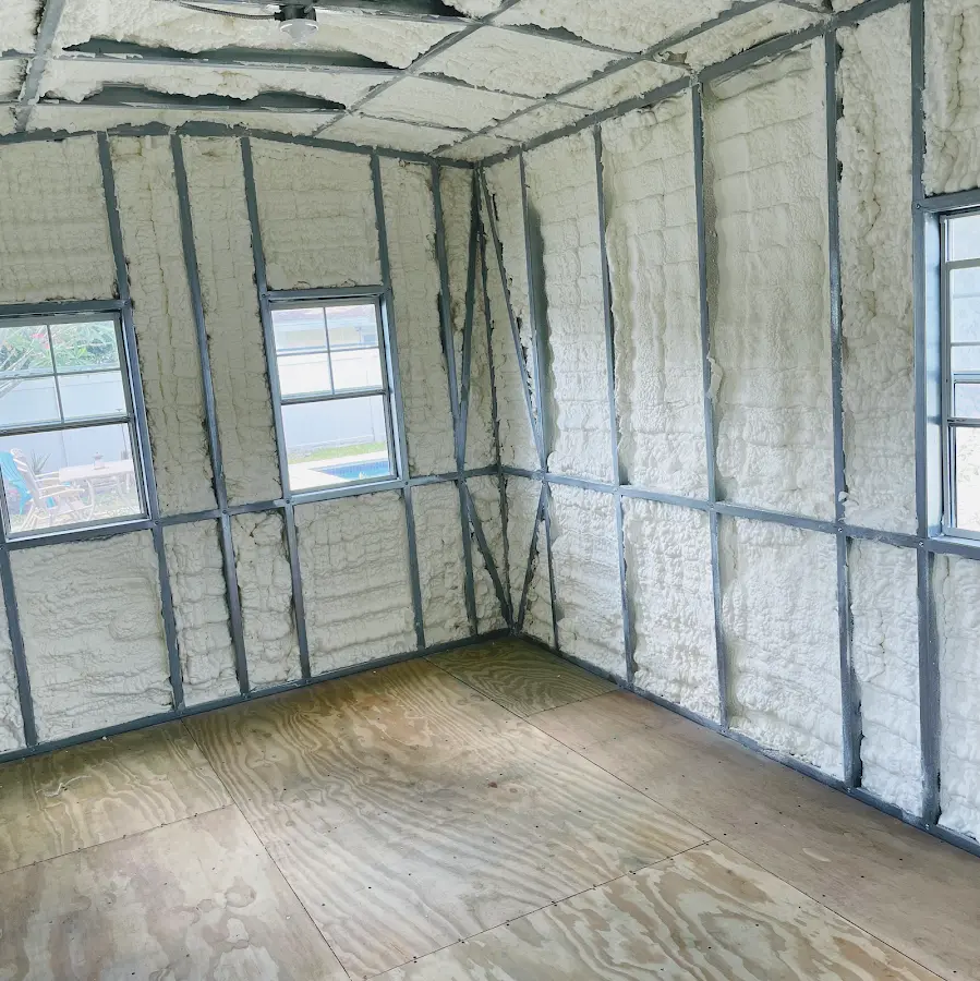Closed-cell spray foam insulation applied to wall cavities in a residential project in Kennebunk